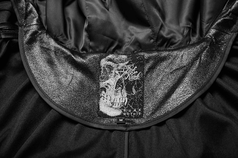 Close-up detail of gothic cape inner collar lining with satin fabric and branded sizing label