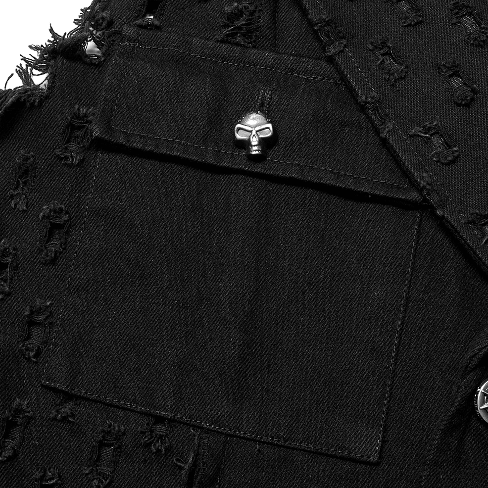 Close-up detail of black denim-like fabric with skull-shaped metal button and distressed frayed chest pocket
