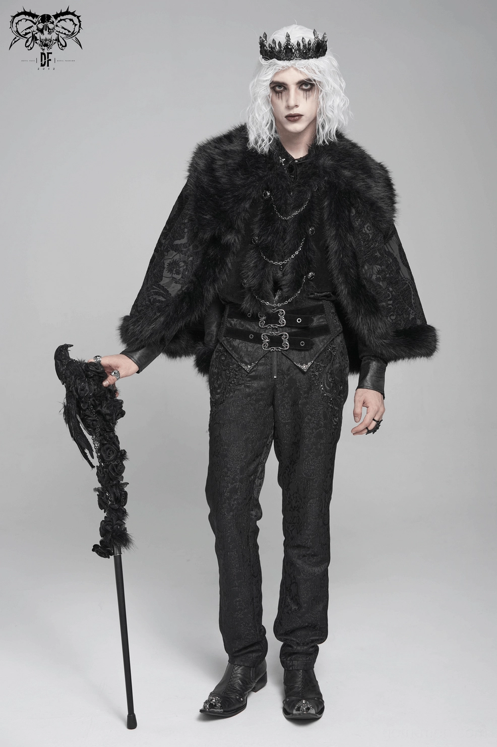 Three-quarter back view of black gothic cape showing faux fur collar and hem trim with paisley occult pattern