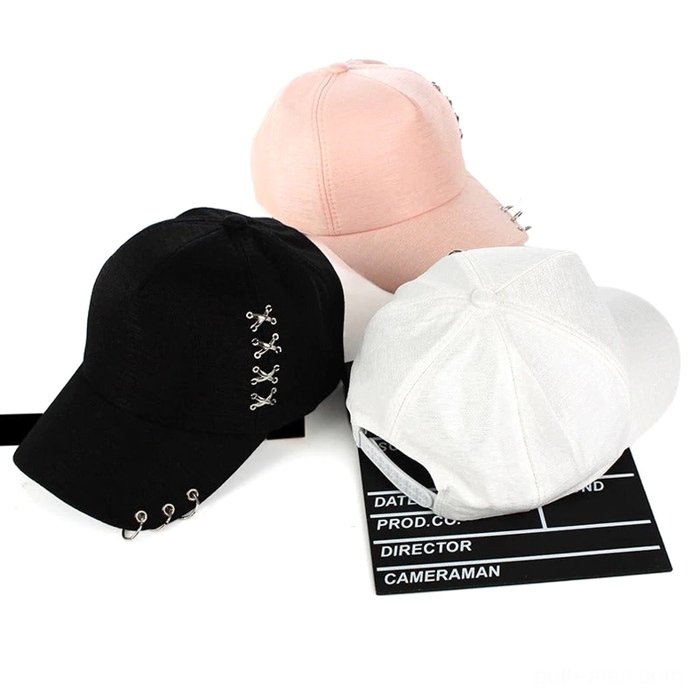 Multiple color options of metal ring gothic baseball caps in black white and pink flat lay
