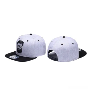 Pair of matching gothic snapback caps with embroidered mustache design displayed side by side in grey and black colorway