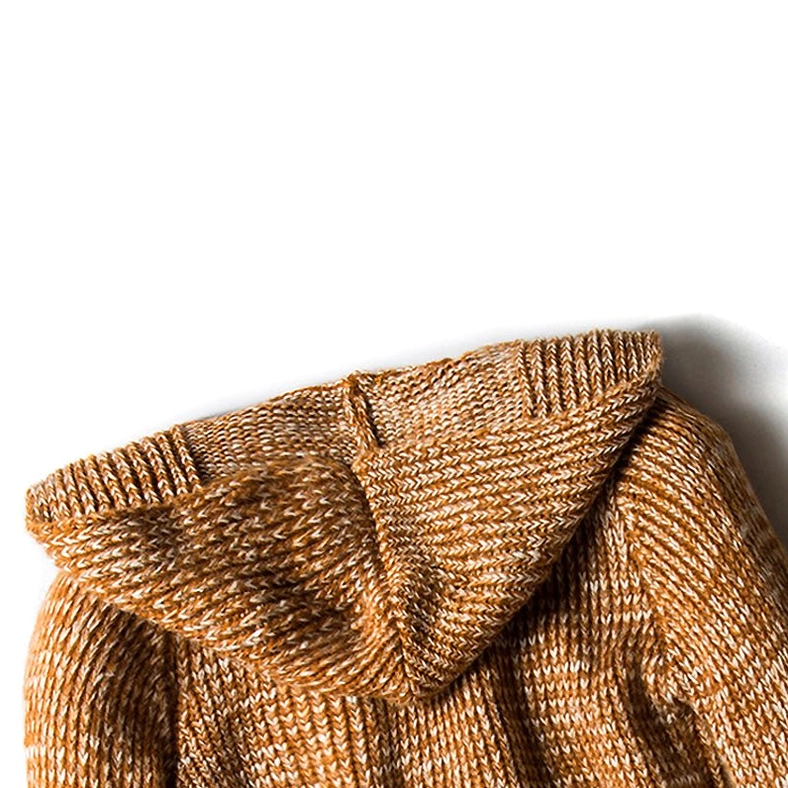 Tan ribbed knitted fabric close-up of gothic hooded cardigan coat side seam detail