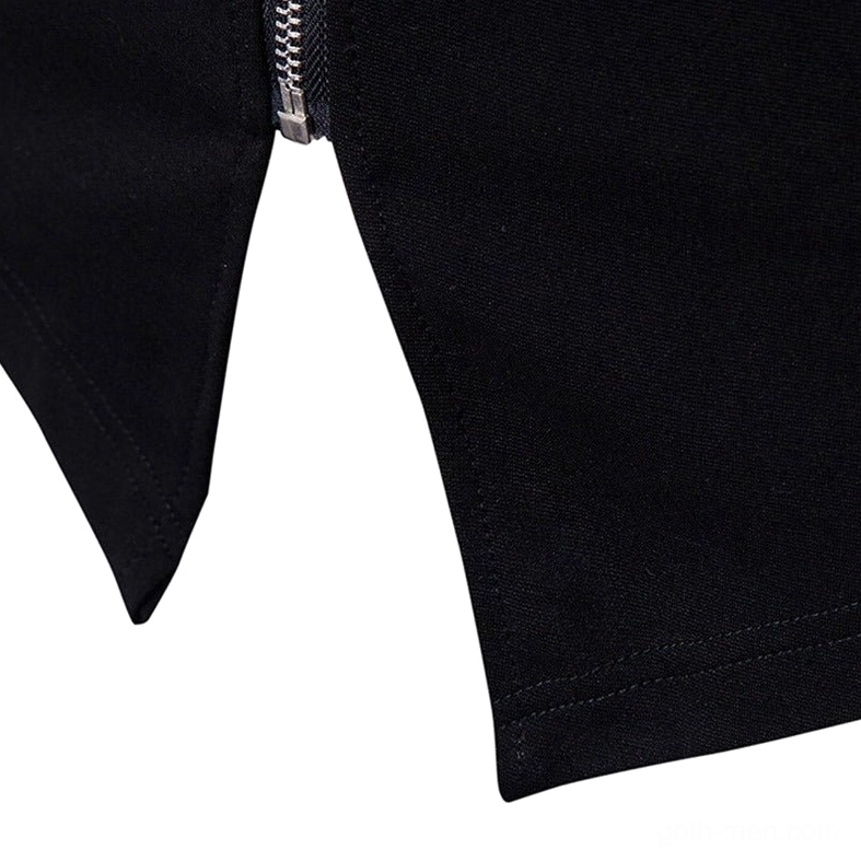 Close-up detail of black gothic cardigan hem and silver metal zipper showing irregular curved hemline and industrial hardware