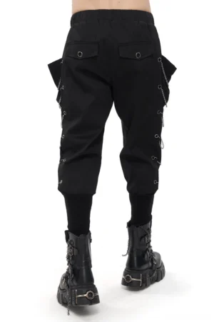 Rear view of black gothic cargo pants displaying back flap pockets and chain eyelet trim detail