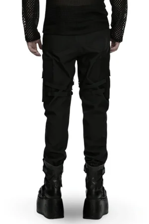 Black gothic cargo pants rear full-body view displaying thigh buckle straps and tapered cuffed legs