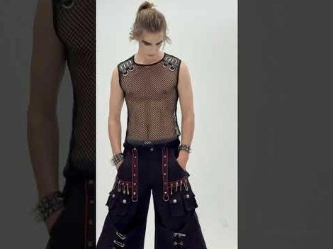 Cyberpunk gothic cargo pants styled with fishnet tank top alternative fashion look