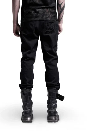 Black gothic cargo pants rear view worn by male model, displaying embroidered back pocket and structured silhouette