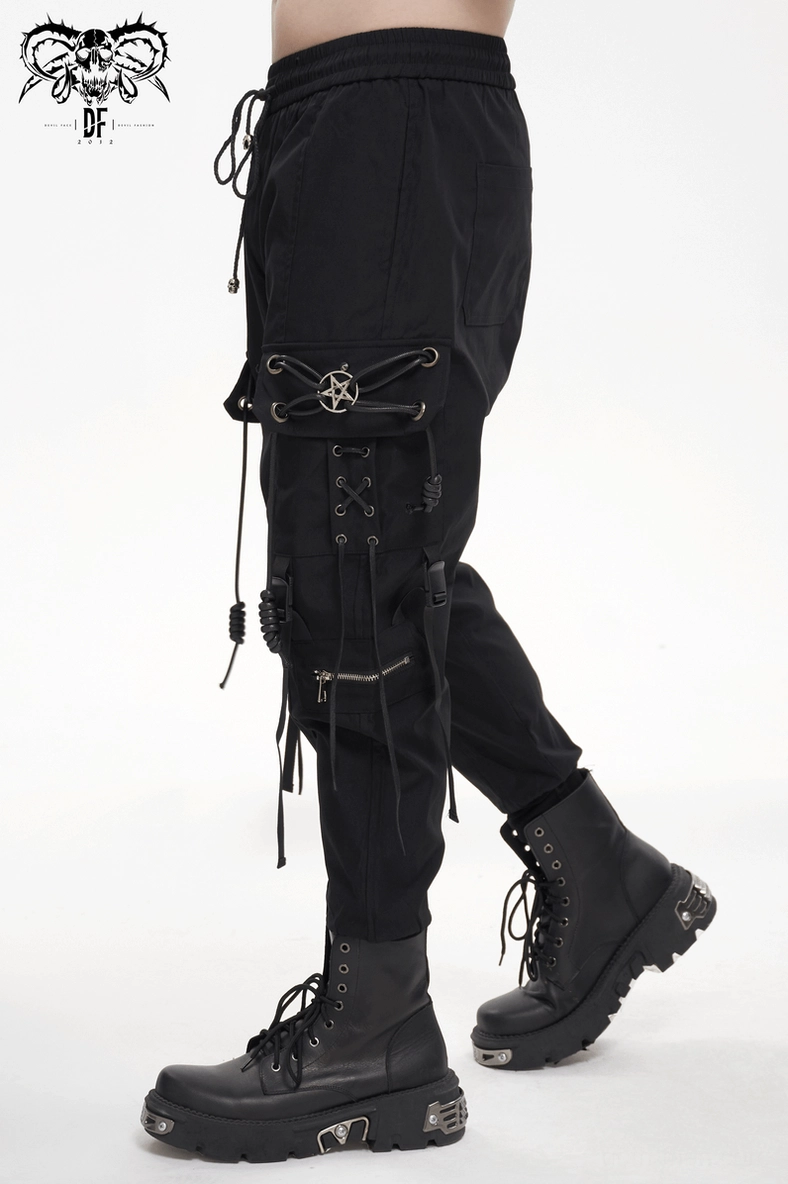 Detailed view of black gothic cargo pants texture, weave, and pentagram metalwork hardware craftsmanship