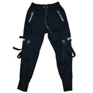 Black gothic cargo pants flat lay showing cotton fabric, buckle pockets, and lettered patch ornaments