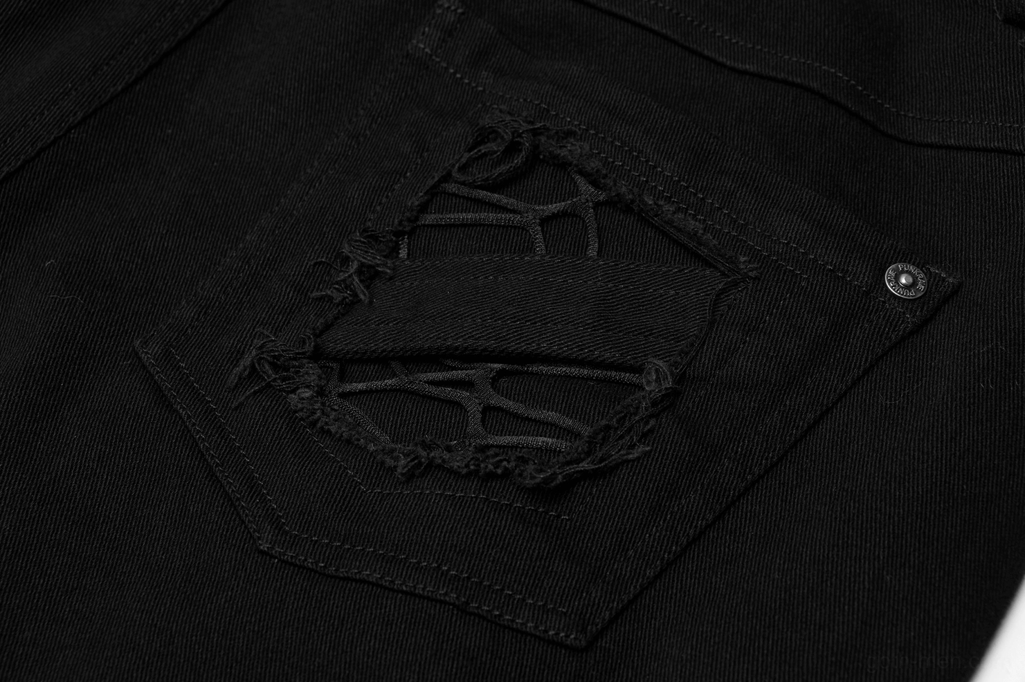 Close-up macro detail of pocket webbing and frayed strap design on black gothic cargo pants