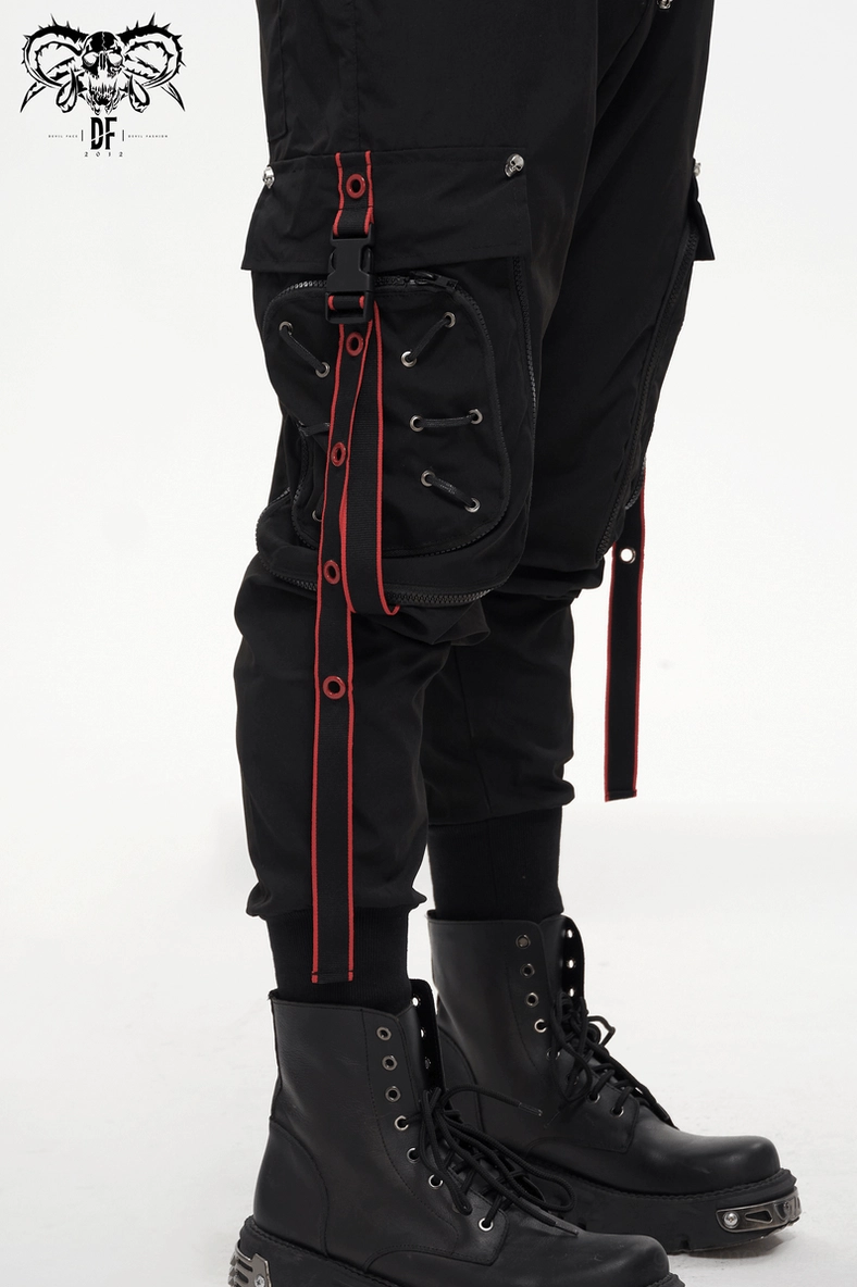 Black gothic cargo trousers side view worn with platform combat boots - alternative fashion styling