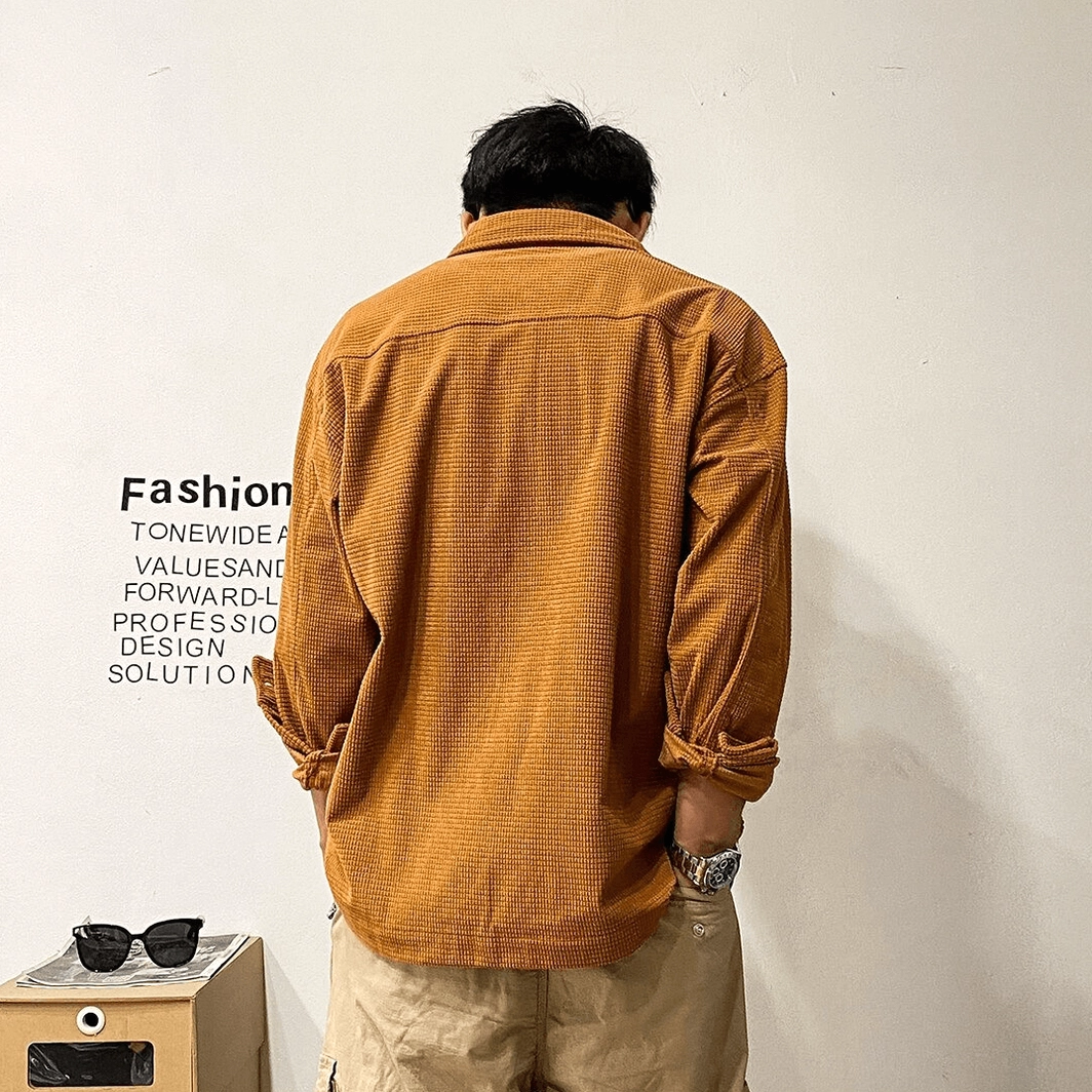Oversized gothic cargo shirt with close-up texture shot revealing broadcloth weave, matte finish, and fabric quality for alternative menswear construction
