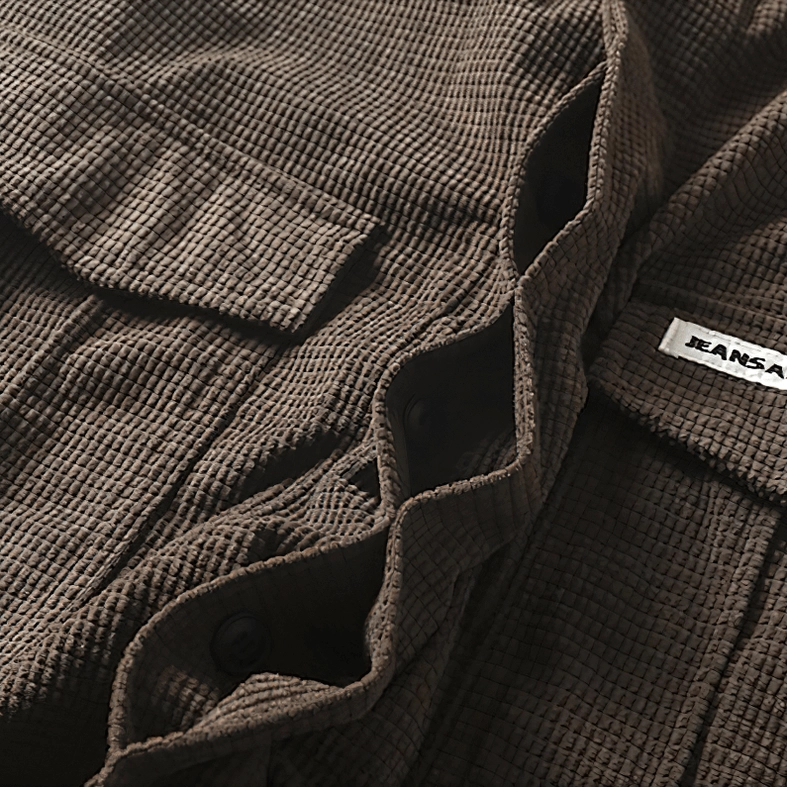 Oversized gothic cargo shirt detail showing button placket, collar construction, and how to layer this piece within alternative fashion wardrobe