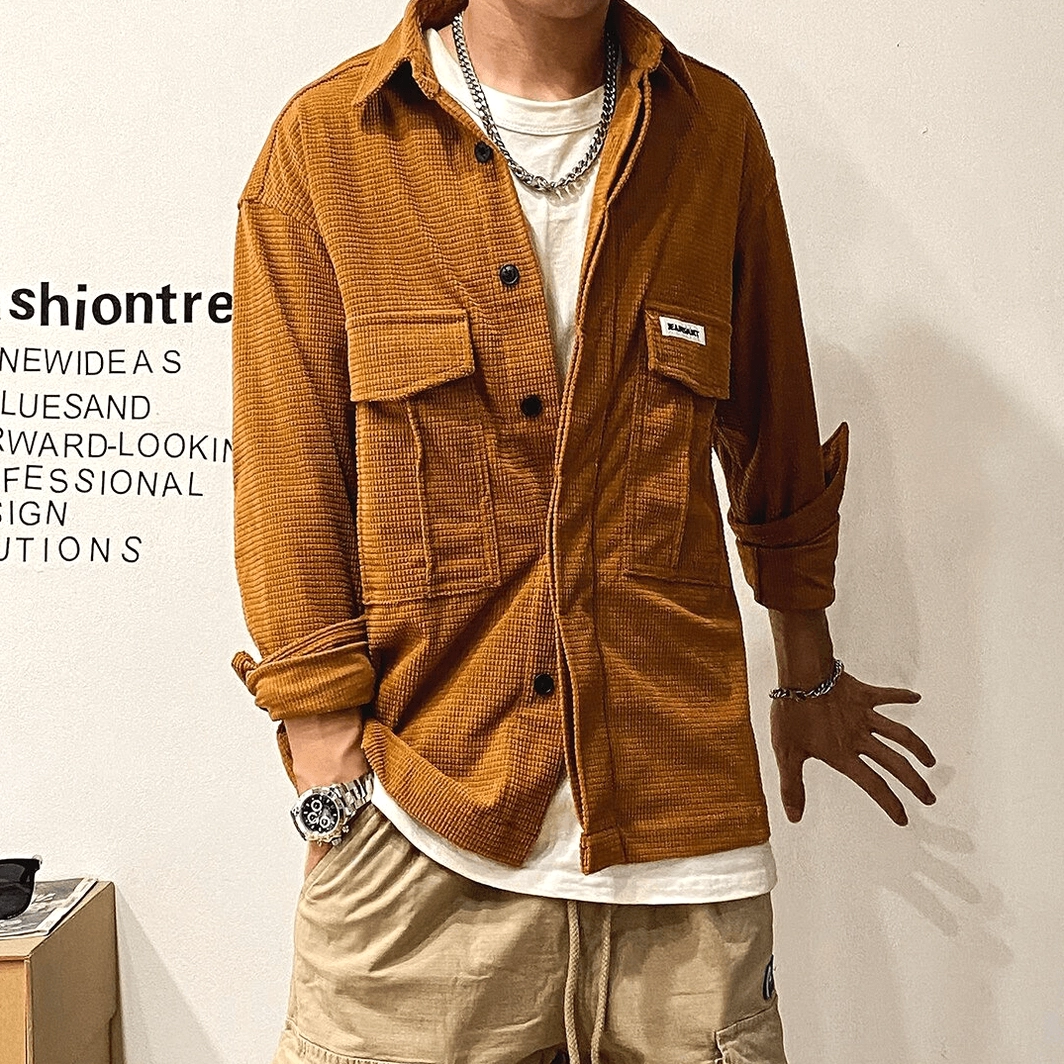 Multiple oversized gothic cargo shirts displayed showing color range and consistency of design across black, brown, and tan alternatives for goth fashion