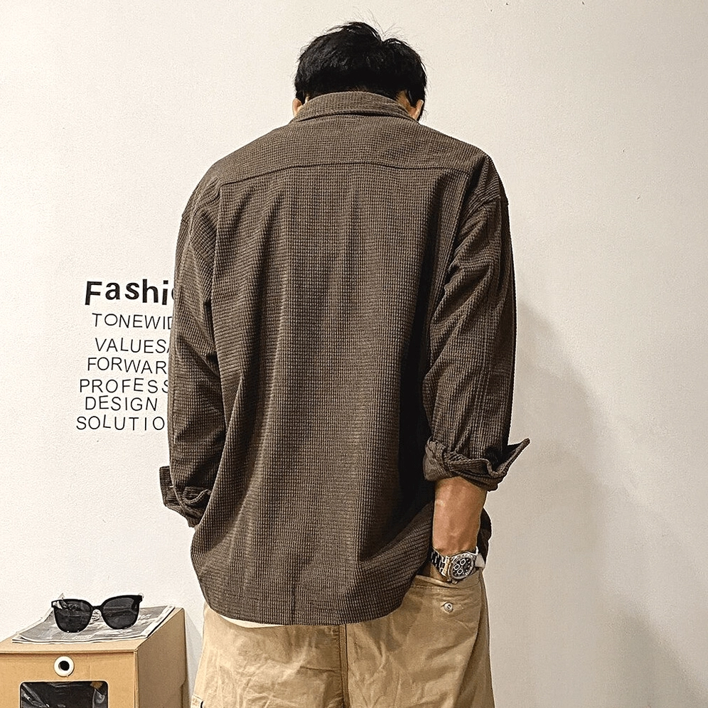 Oversized gothic cargo shirt in neutral earth tone showing overall proportions, button front closure, and how fabric drapes for relaxed alternative style