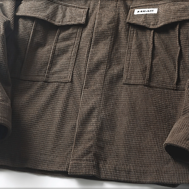 Oversized gothic cargo shirt on model showing how the dual pockets function and position visually, key design feature of this alternative fashion piece