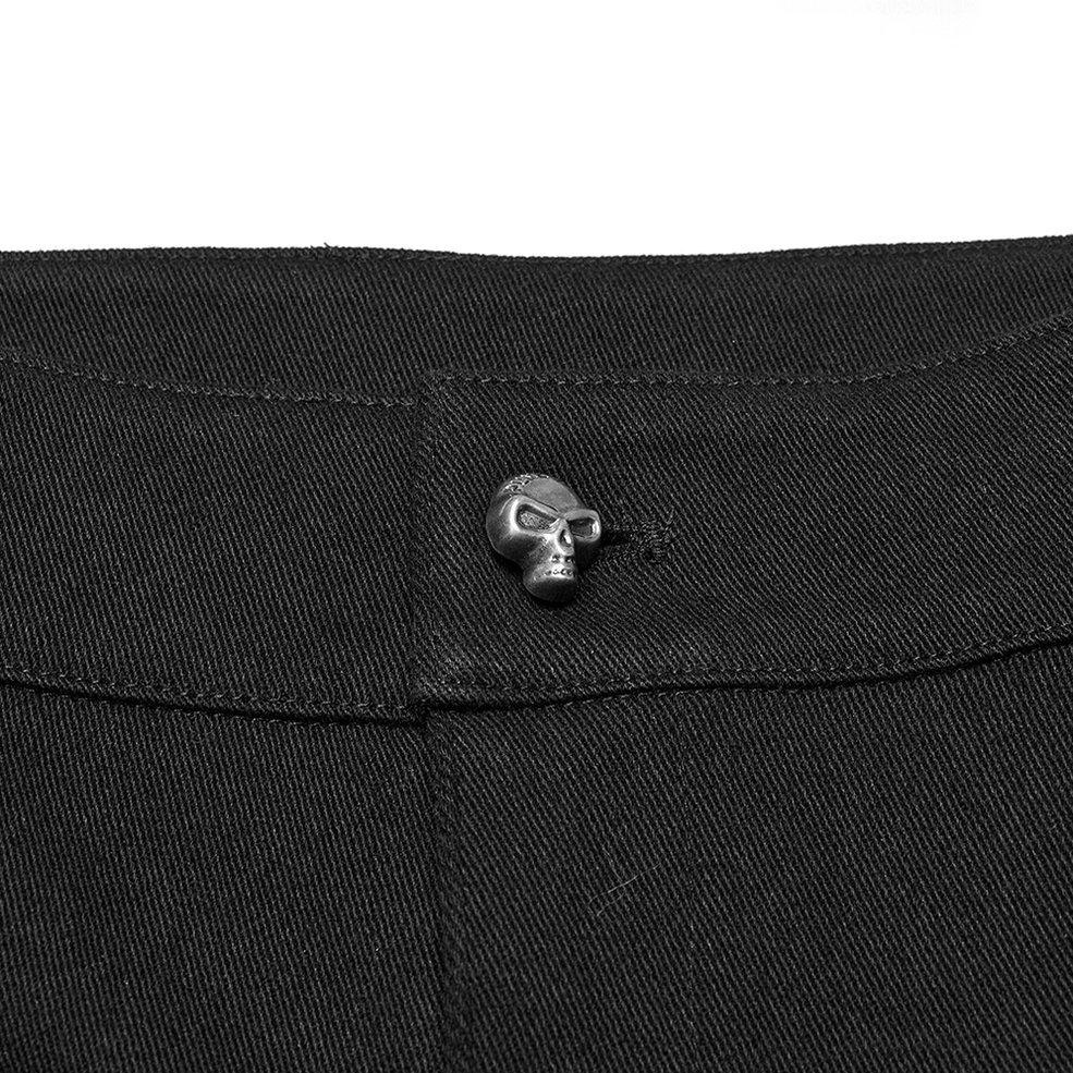 Detail shot of gothic cargo shorts fabric texture showing elastic twill weave and leather panel integration