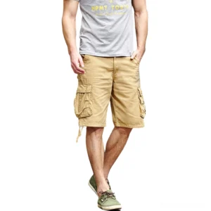 Male model wearing khaki gothic utility cargo shorts with multi-pocket design, full-body standing view