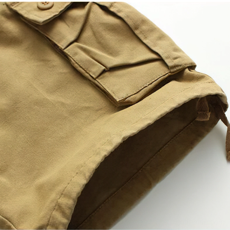 Detailed view of flap cargo pocket, drawstring hem, and reinforced stitching on gothic shorts