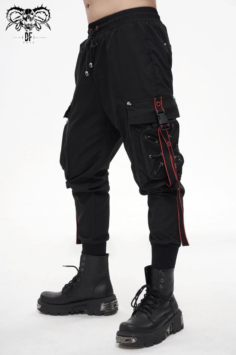 Alternative angle of black gothic cargo trousers showing pocket placements and red strap details