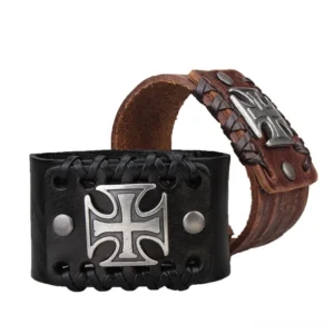Gothic Celtic cross leather cuff bracelet in black and brown - front oblique view showcasing metal cross ornament and braided edges