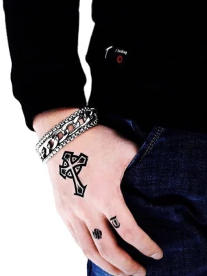 Double-chain stainless steel gothic bracelet worn on tattooed male wrist, side view close-up showcasing industrial punk design with silver polished finish
