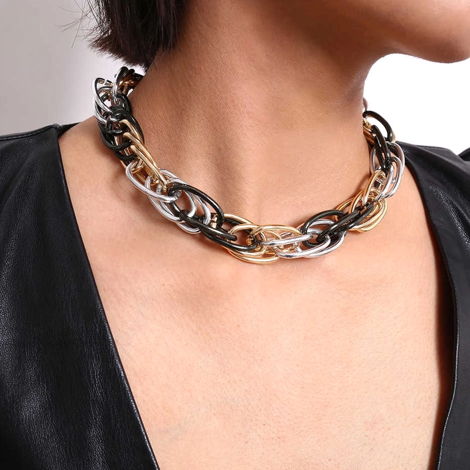 Woman wearing heavy twisted chain necklace as gothic choker with leather styling