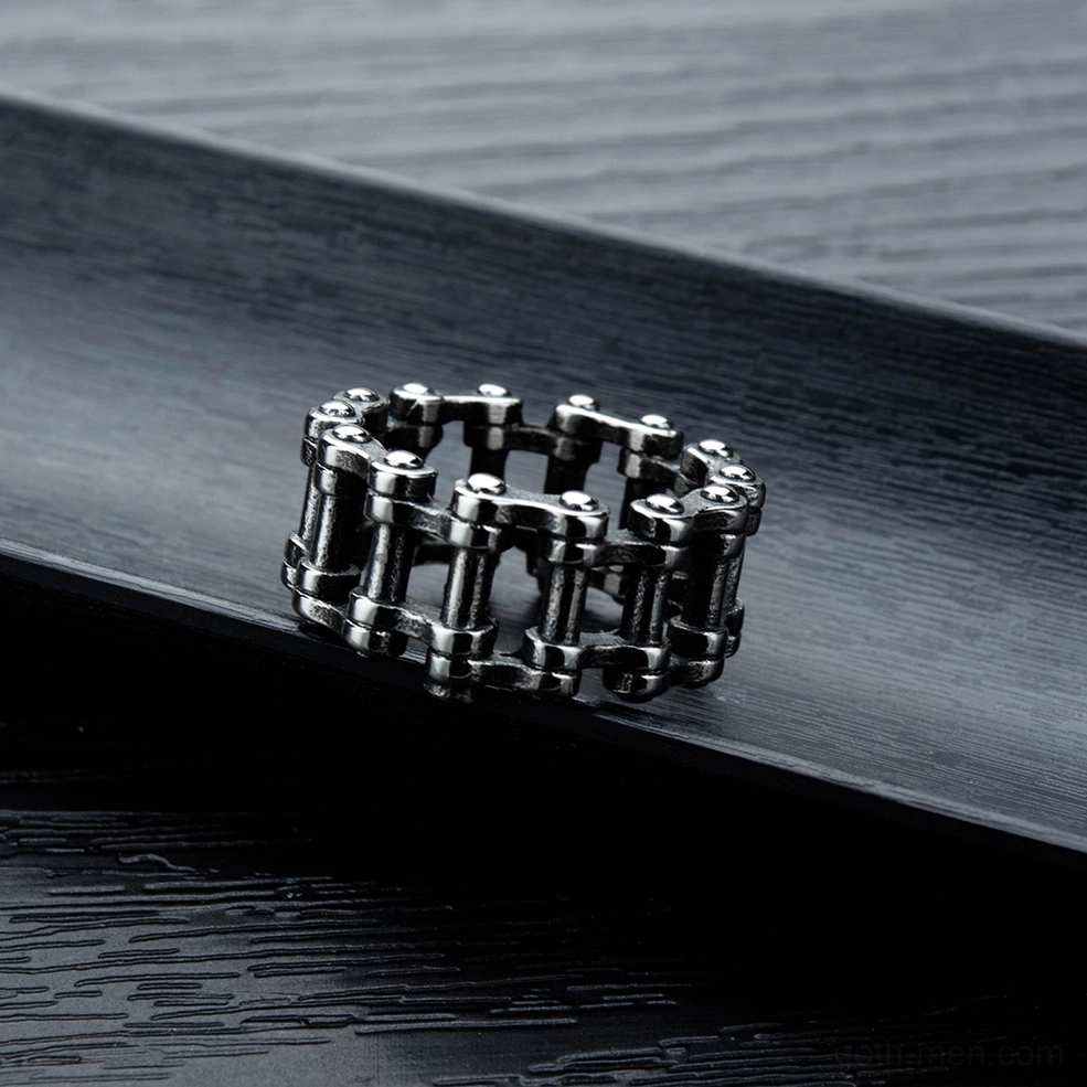 Gothic chain link ring side angle showcase highlighting industrial metal construction and dark aesthetic on wooden surface