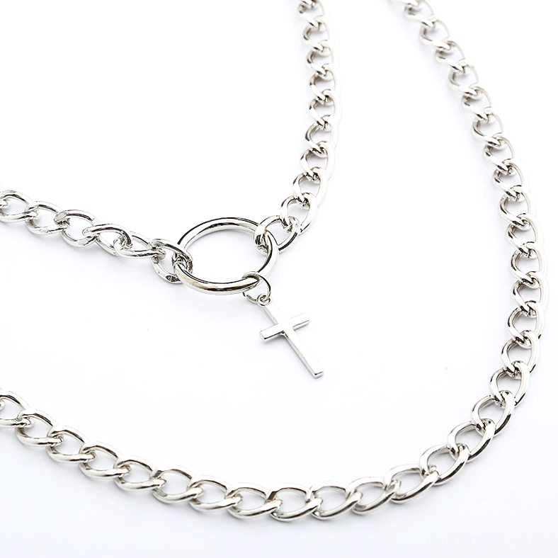Close-up flat lay of dual-layer gothic chain necklace set showing mixed chain thickness, padlock pendant focal point, metal craftsmanship