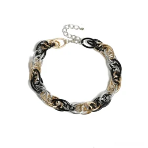 Mixed metal heavy chain necklace featuring intertwined gold silver and black links in curb pattern