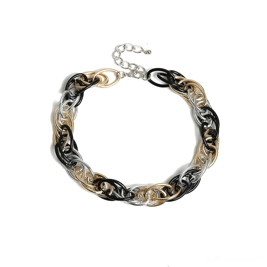 Mixed metal heavy chain necklace featuring intertwined gold silver and black links in curb pattern