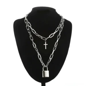 V-shaped double thick silver chain gothic necklace with cross and padlock charms on mannequin display