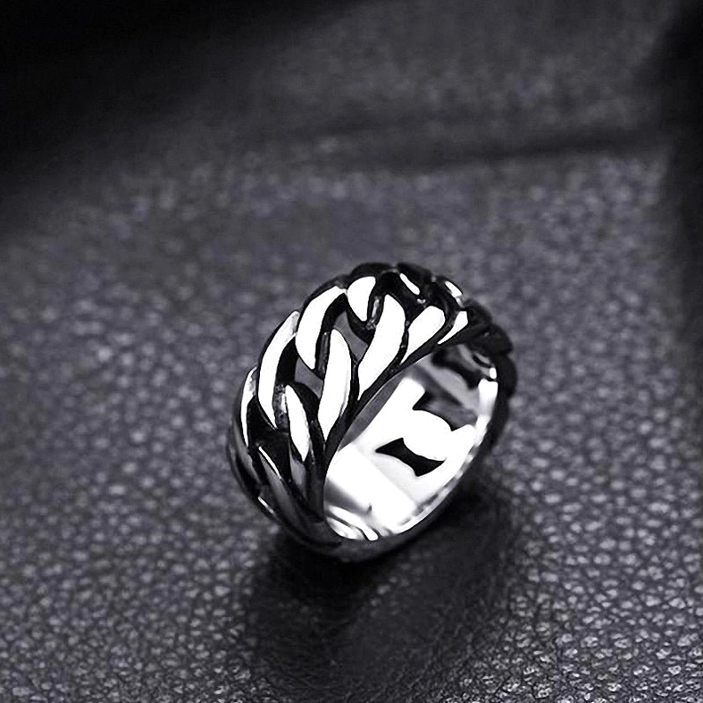 Bright silver gothic braided chain ring on fine grain black leather, side angle view