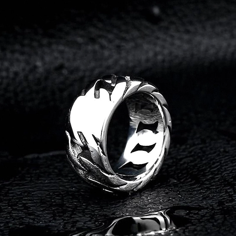 Bright silver gothic chain link ring interior carved hollow texture on dark leather background