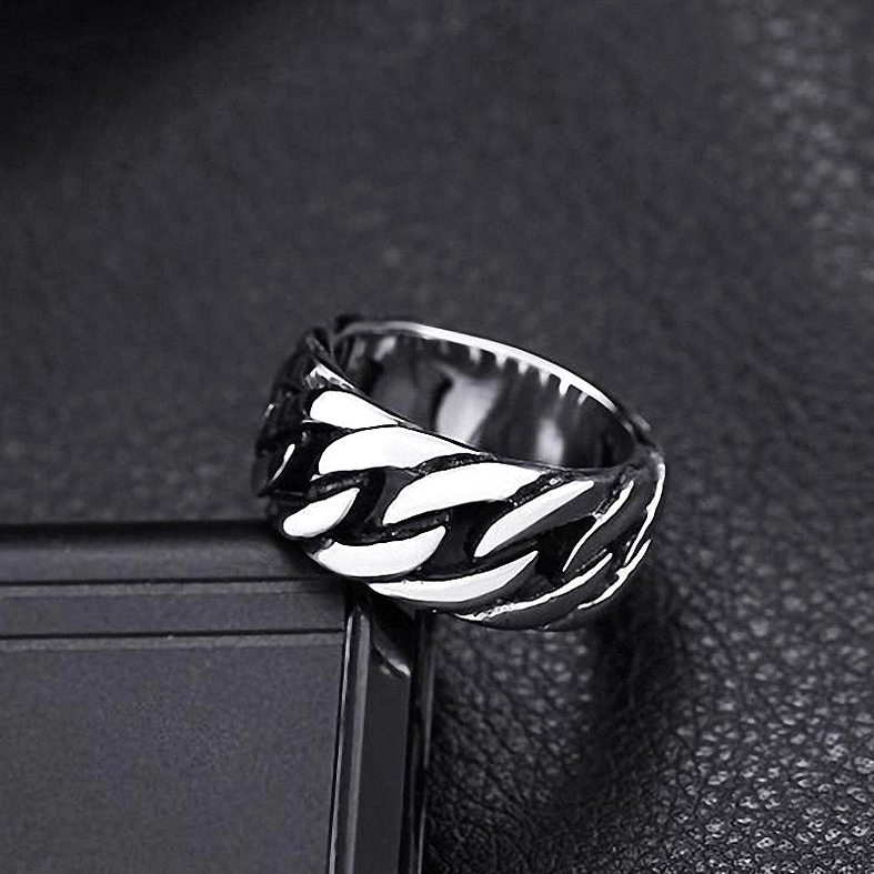 Gothic chain link ring in silver tone on dark leather showing dimensional chain pattern