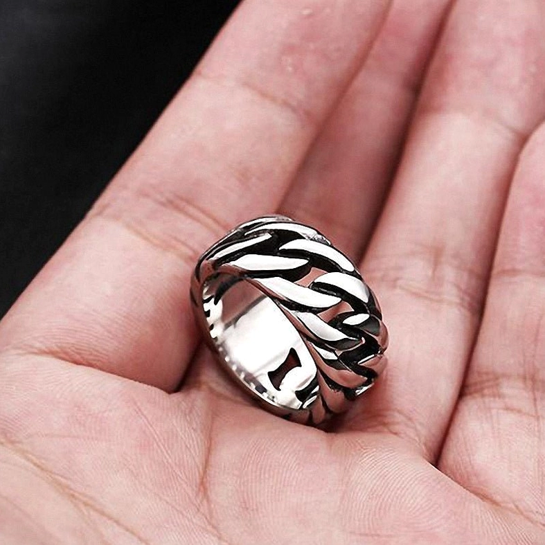 Polished silver gothic biker chain ring showing hollow link construction on dark background