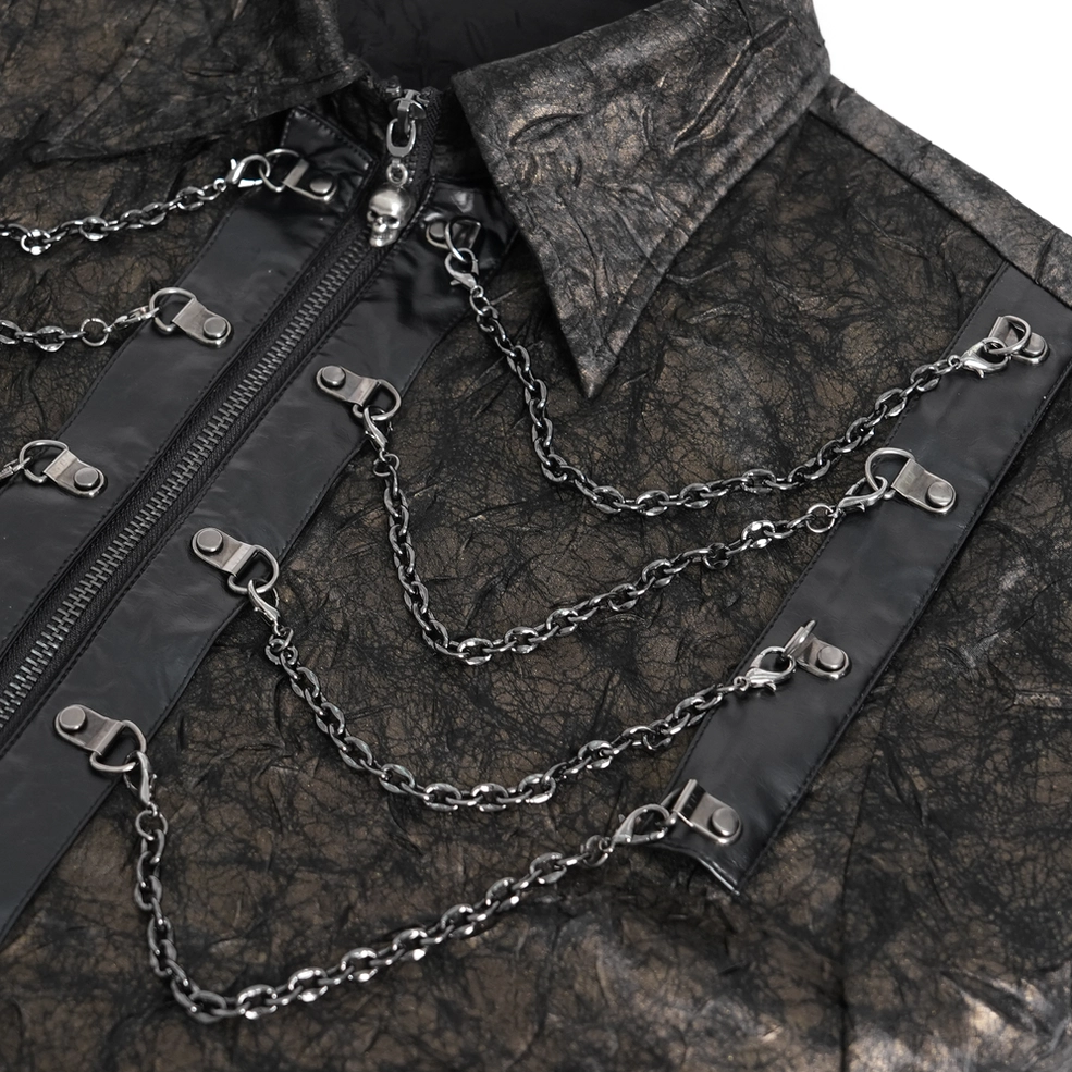 Extreme close-up metal chain harness decorations skull charms crinkled textured fabric