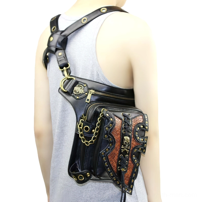 Gothic steampunk shoulder bag worn across back of female model, single shoulder strap with metal chain decoration and skull design