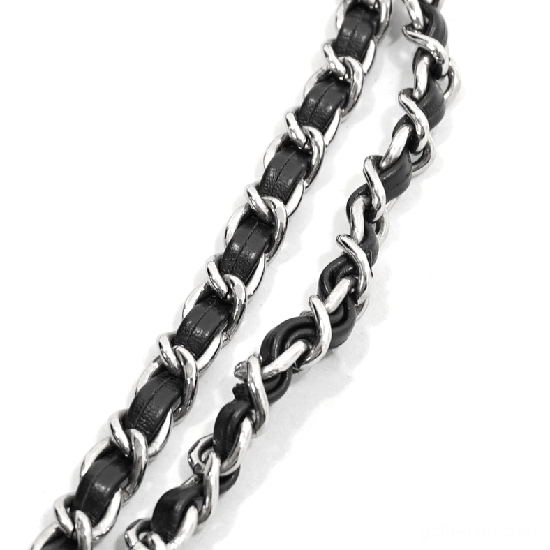 Woven metal chain strap with leather inserts and silver metal hardware attachment detail