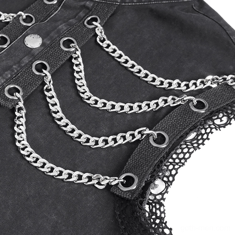 Close-up detail of industrial gothic vest showing curb chains, metal eyelets, and mesh trim texture