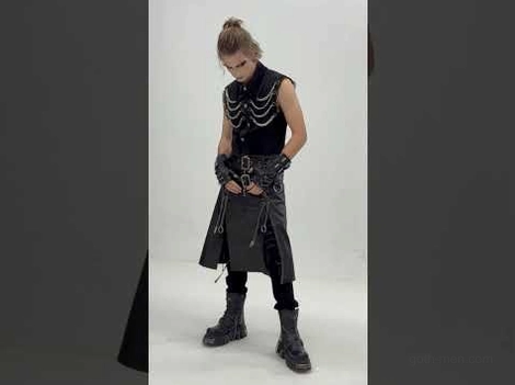 Male model wearing industrial gothic chain vest with all-black goth styling and outfit coordination