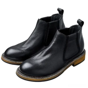 Men's black leather gothic Chelsea ankle boots with elastic side gussets and heel pull tab, three-quarter flat view