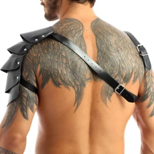 Gothic leather harness rear view showing adjustable cross-back strap design and layered shoulder pads on tattooed male back