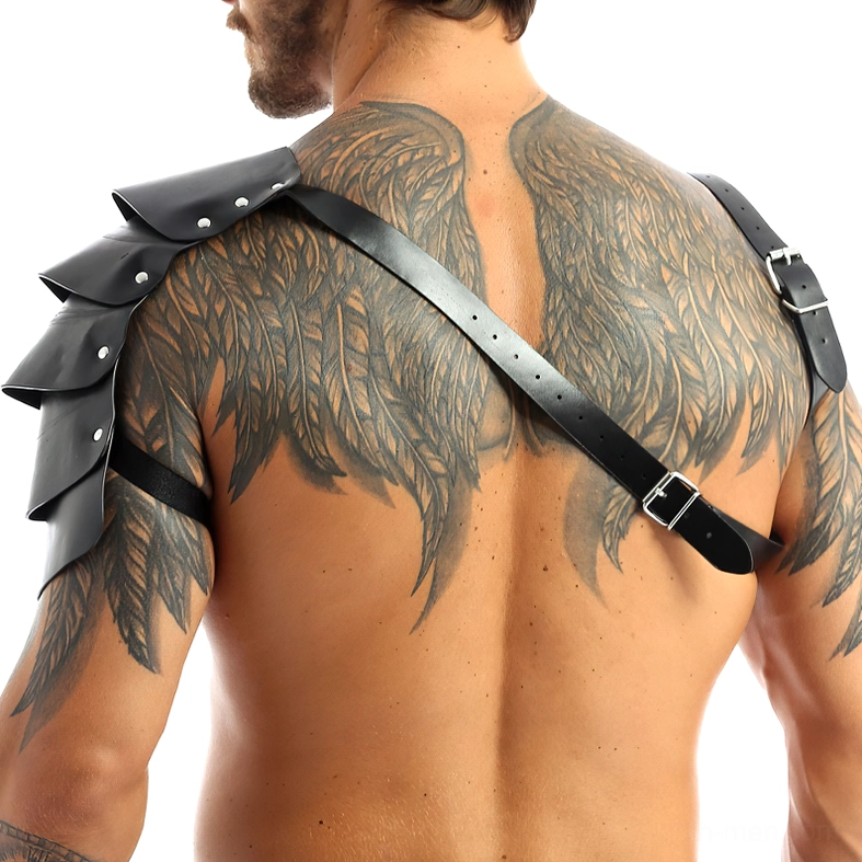 Gothic leather harness rear view showing adjustable cross-back strap design and layered shoulder pads on tattooed male back