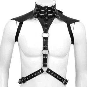 Black faux leather gothic chest harness front view on male mannequin torso, featuring adjustable straps, metal O-rings, and structured shoulder caps