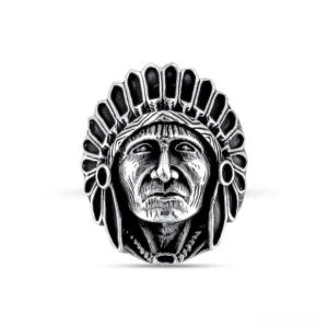 Dark silver gothic chief ring frontal view showing intricate carved tribal portrait and vintage metal texture