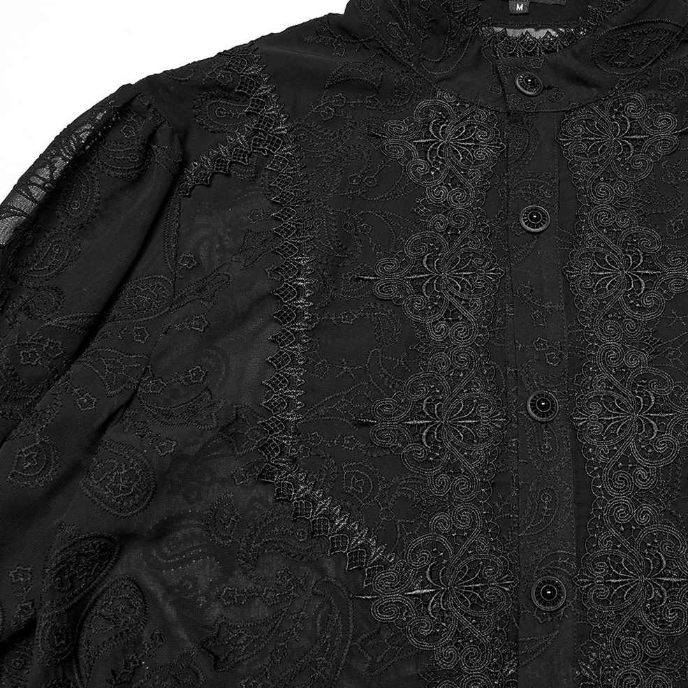 Close-up of black gothic chiffon shirt front placket showing detailed floral embroidery and buttoned closure