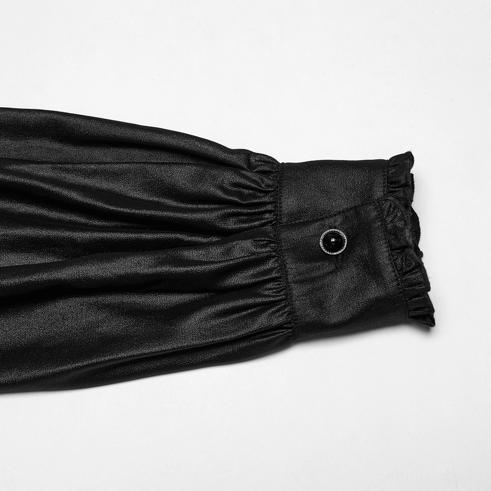 Side close-up detail of ruffled cuff trim and black decorative button on gothic chiffon lantern sleeve