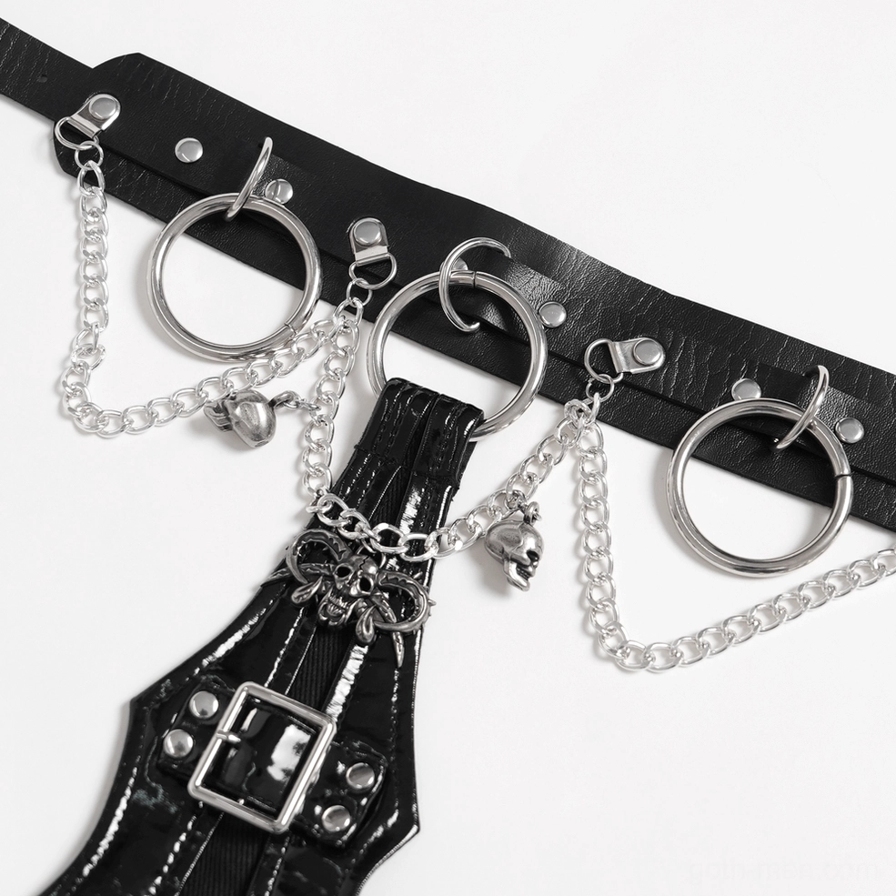 Close-up macro shot of gothic choker hardware featuring black PU strap, silver O-rings and skull charm chains