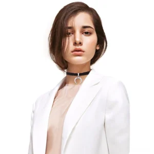 Woman wearing black velvet crescent moon choker with white blazer - gothic choker styling on model